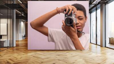 Horizontal shot of teenager taking photos with vintage camera Wall mural