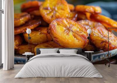 A closeup of fried plantains on a plate Wall mural