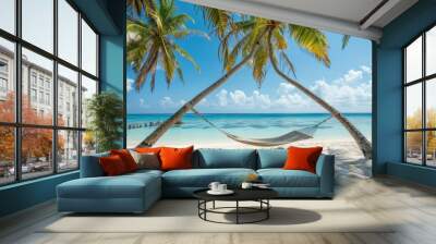 A serene hammock between palms on a beautiful sandy Maldive beach symbolizes summer vacation Wall mural