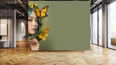 asian woman with green hairs and flowers with butterfly on a pure vivid yellow background with empty space for text and design Wall mural