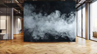 Close up of mist rising above water droplets swirling from humidifier spray on black background Wall mural