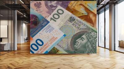 Closeup of 50, 100 and 200 Swiss franc banknotes and 100 polish zloty banknotes Wall mural