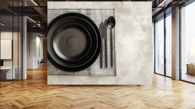 Elegant table with black plates on white background Wall mural