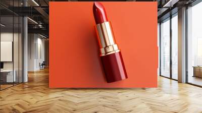 Close-up of red lipstick on a beige background. Wall mural