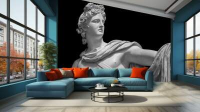 God Apollo bust sculpture. Ancient Greek god of Sun and Poetry Plaster copy of a marble statue isolated on black Wall mural