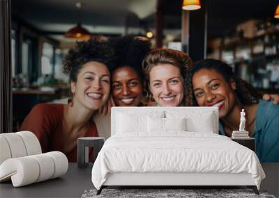 Mature women hug and look at camera on city street. Portrait of happy middle age friends outside. Female friendship Wall mural