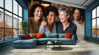 Mature women hug and look at camera on city street. Portrait of happy middle age friends outside. Female friendship Wall mural