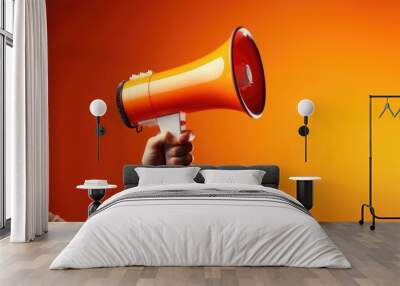 Megaphone in hand on a orange background, attention concept announcement Wall mural