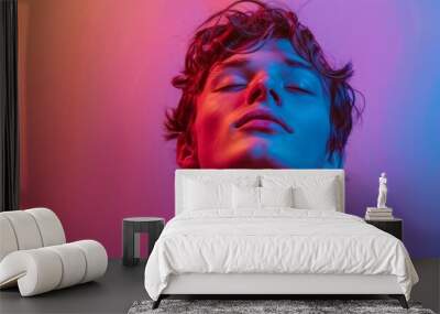 Profile portrait of young man on purple neon studio backdrop Wall mural