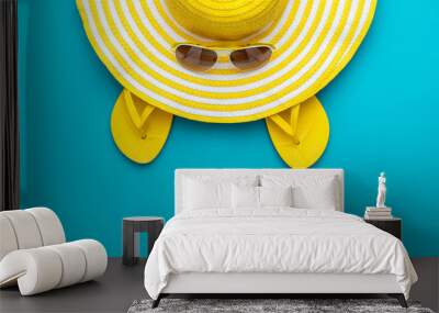 top view of yellow sunglasses, striped retro hat and flip-flops Wall mural