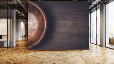 wooden salad bowl on the brown table Wall mural