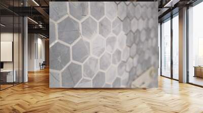 Interior Design Hexagon Marble Tile. A white wall with hexagon tiles for texture and background. Mosaic tile wall with white grout. Wall mural