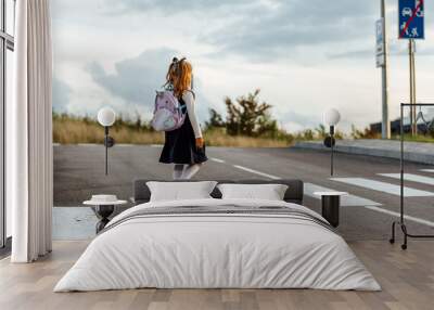 schoolgirl crosses the road at a pedestrian crossing Wall mural