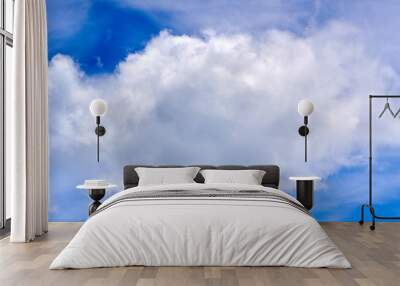 White cumulus puffy cloud in blue sky background. Wall mural