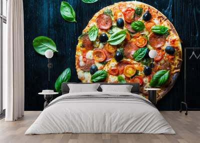 pizza with salami, olives and basil Wall mural