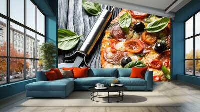 pizza with salami, olives and basil Wall mural