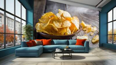 Potato chips on a wooden table Wall mural