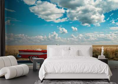 Old retro car standing on the highway against blue sunny sky Wall mural