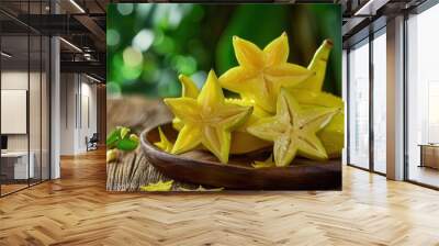 Star fruits sliced on table Popular sweet fruit in Asia Focus on wood background Wall mural