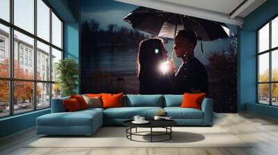 young man and woman under an umbrella and rain Wall mural