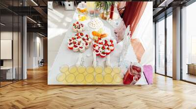 Candy bar. Wedding table with sweets, cupcakes Wall mural