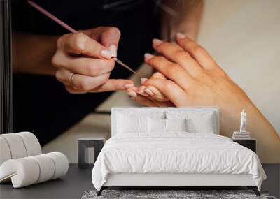 Woman in salon receiving manicure Wall mural