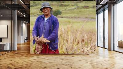 Native american woman on the quinoa field. Wall mural