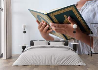 Quran - holy book of Muslims religion, Concept: open book holy prayers for god, Friday In the month of Ramadan  religion Islamic worshiping faith and learn koran and rosary put on wooden  boards  Wall mural