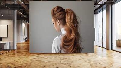 Voluminous High Ponytail - A statement-making and glamorous ponytail style with added volume, achieved through teasing or backcombing the hair at the crown for a dramatic and head-turning effect  Wall mural