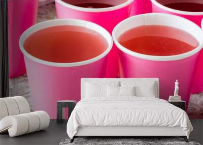 A few cups with two kinds of fruit lemonade. Wall mural