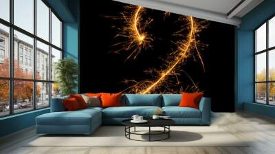 Digit 2 or two made of bengal fire, sparkler fireworks candle isolated on a black background. Party dark backdrop. Wall mural