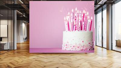 Pink birthday cake with many pink birthday candles and sparklers Wall mural