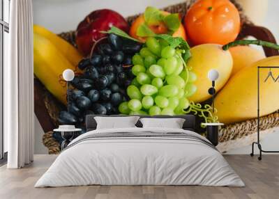 basket with fresh fruit and juice on white modern office table Wall mural