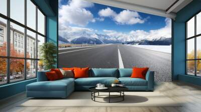 empty asphalt road with snow mountains in blue cloud sky Wall mural