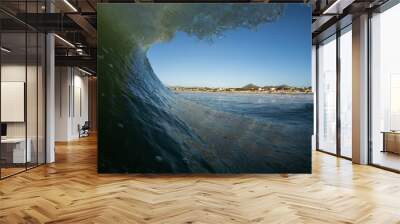 perfect wave breaking on a beach with no people Wall mural