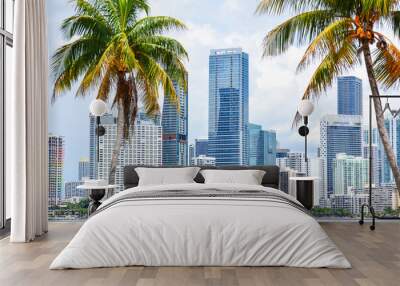 High-rises crowd the downtown Miami skyline along waterfront seen through palm tress in South Florida, United States Wall mural