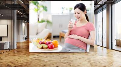 Asian pregnant woman drinking milk Wall mural