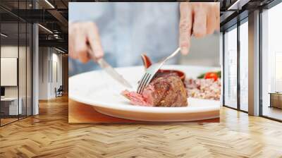 senior man eat grilled steak Wall mural