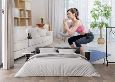 woman doing exercise at home Wall mural