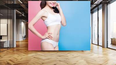 woman show her thin waist Wall mural