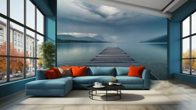 Dock overlooking a calm overcast lake. Wall mural