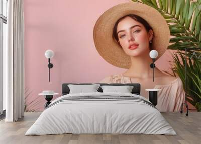 Beautiful Woman in a Straw Hat with Palm Leaves in the Background Wall mural