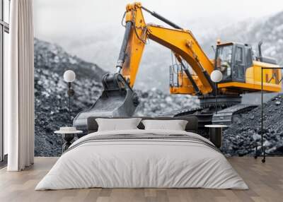 Heavy machinery is used for coal mining, showcasing excavator digging into earth. powerful equipment highlights industrial process of extracting resources Wall mural