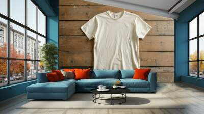 Plain white t shirt on wooden background, showcasing simplicity and comfort. Ideal for casual wear or layering.  Wall mural