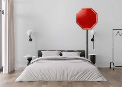 Stop sign on plain background, conveying sense of caution and alertness.  Wall mural