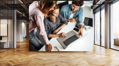 Group of young people working or studying together. Hipster team in coworking. Young modern business colleagues. Startup concept Wall mural