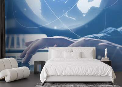 Man with laptop and abstract hologram of a globe Wall mural