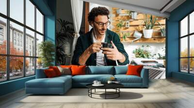 Man with laptop working remotely from home Wall mural