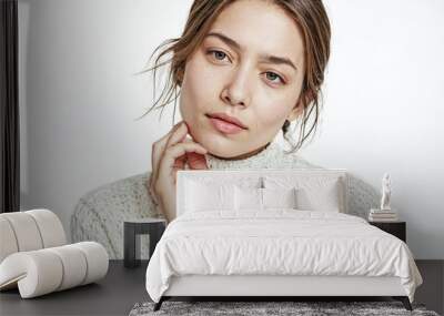 Portrait of a beautiful young woman in a white sweater Wall mural