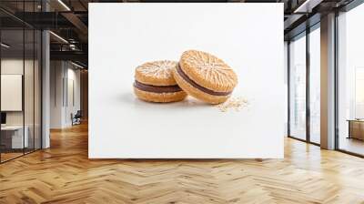 Two Chocolate Filled Cookies with White Icing and Oatmeal Wall mural